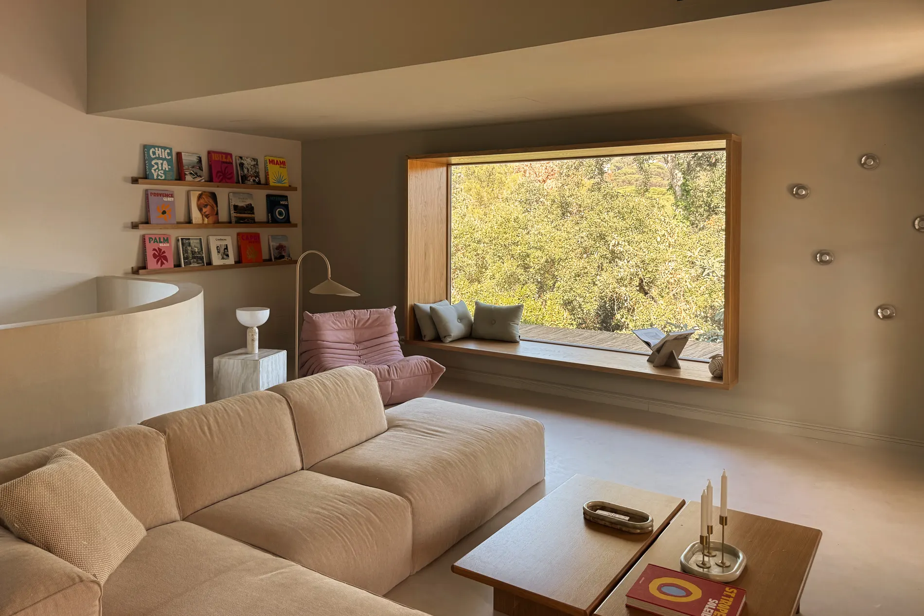 Living room with a built-in window seat overlooking the garden